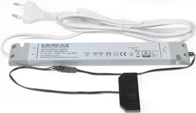 An LED power converter with its power cord and a small connector attached.