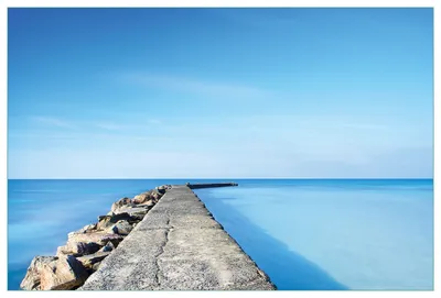 Produktbild von Wallario Küchenrückwand aus Glas, Größe: 90 x 60 cm, Motiv: Pier am blauen Ozean mit blauem Himmel | Spritzschutz | abwischbar | pflegeleicht | in