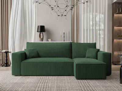 A green sectional sofa is shown in a well-lit living room setting.