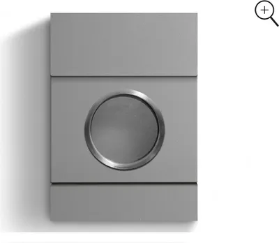 A close-up studio shot of a modern, minimalist mailbox with a circular opening and a metallic rim.