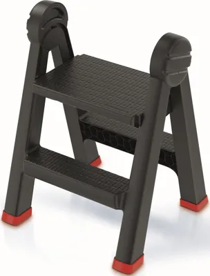 A black folding step stool with red feet is shown against a white background.