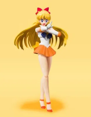 A full-body shot of a Sailor Venus action figure against a plain yellow background.