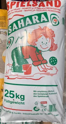 A bag of Spielsand Sahara 25kg with a cartoon child playing in sand.