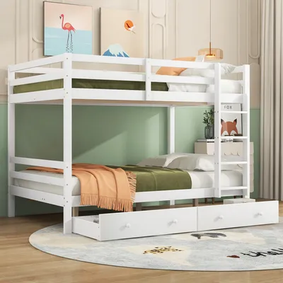 A white wooden bunk bed with mattresses, blankets, and storage drawers, set in a room with artwork on the wall.