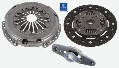 A clutch kit for a vehicle, including the pressure plate, clutch disc, and release fork, laid out on a white background.