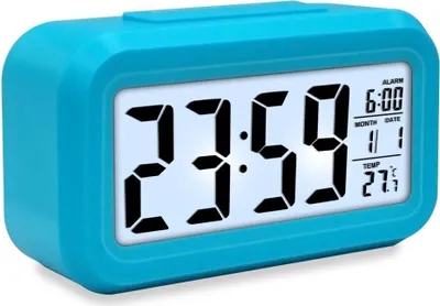 A blue digital alarm clock displaying the time, date, and temperature.
