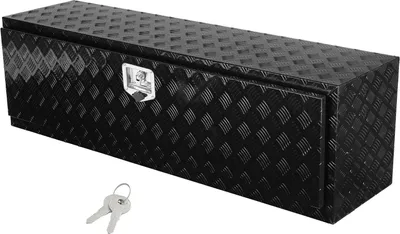 A black diamond-plate aluminum toolbox with a silver latch and two keys in front of it, set against a white background.