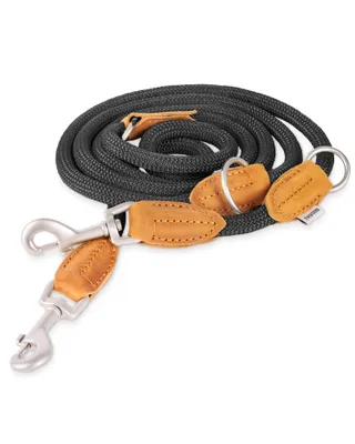 A coiled black rope dog leash with leather accents and metal clasps, presented on a white background.