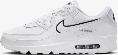A studio shot of a white Nike Air Max 90 sneaker with black accents.