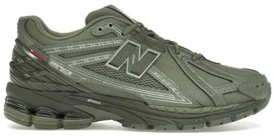 Immagine prodotto di New Balance 1906R Primaloft, colore verde scuro e argento metallizzato - Taglia EU 37