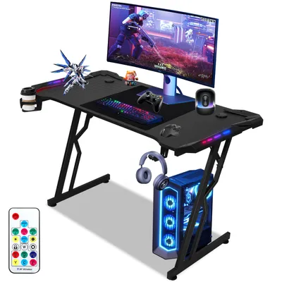 Produktbild von Jopassy 120x60cm Gaming Schreibtisch mit Getränkehalter Kopfhörerhalter und Mauspad, Tischplatte aus Carbon, Z-förmiger (met LED+Fernbedienung)