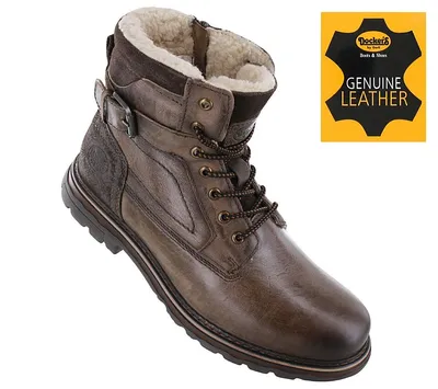 A single brown leather boot with a shearling lining is shown against a white background. A yellow and black graphic indicating 'Genuine Leather' is in the upper right corner.