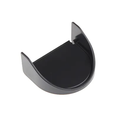 A black plastic coffee cup holder for a Nespresso Inissia machine, shown from a diagonal angle on a white background.