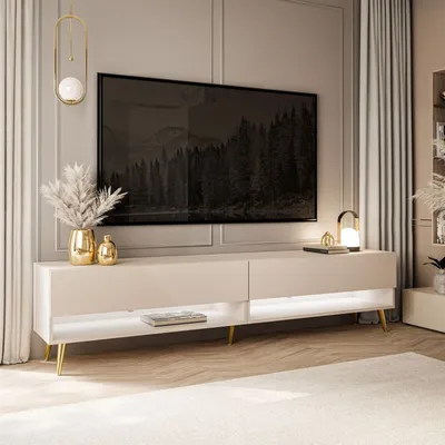 A modern living room with a TV stand and a large television.