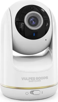 A white baby camera with a black lens and a gold accent band around the base.