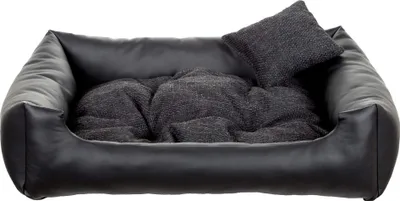 A black dog bed with a gray cushion and pillow, isolated on a white background.