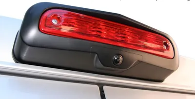 A close-up shot of a car's third brake light with an integrated backup camera.