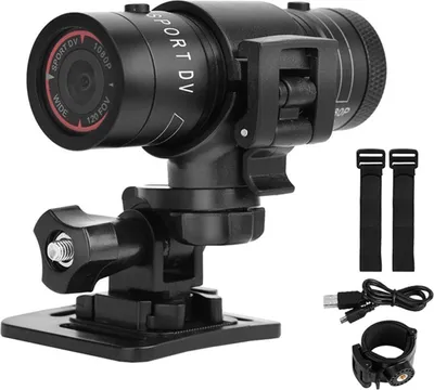 A black action camera with various mounting accessories and cables, displayed against a white background.