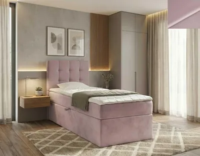 A bedroom scene featuring a pink boxspring bed.
