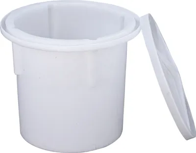 A white plastic fermentation crock with its lid slightly ajar, isolated on a white background.