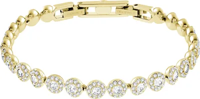 A close-up studio shot of a gold-toned bracelet with clear crystals.