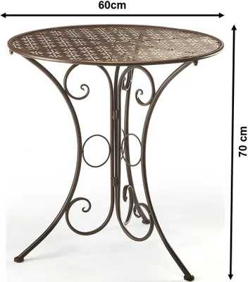 A decorative metal garden table with intricate cutouts.