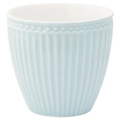 A pale blue ceramic cup with a ribbed texture and a beaded rim.