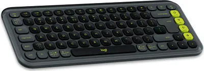 A graphite colored Logitech keyboard with yellow accent keys is shown from a slightly elevated front-side angle on a white background.