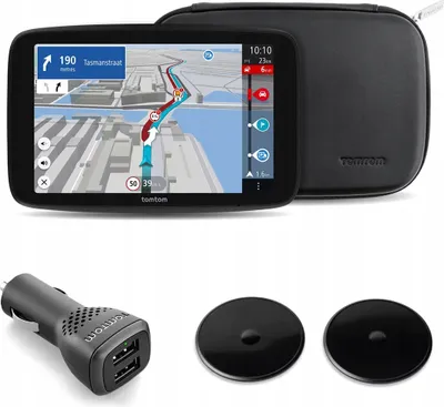 A TomTom GPS navigation device with its accessories, including a car charger and mounting discs, presented on a white background.