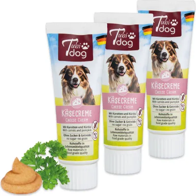 Three tubes of dog treat paste arranged diagonally, with a sprig of parsley and a dollop of the paste in the foreground.