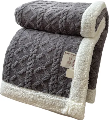 A folded gray blanket with a white fluffy trim.