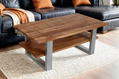 Produktbild von Couchtisch Baumkante massiv Mangoholz honigfarben 115×65 cm silber PATRICK