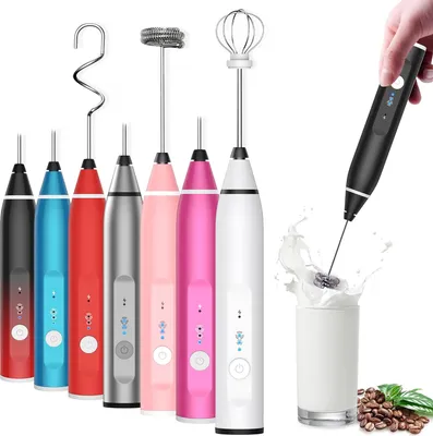 A collection of electric milk frothers in various colors, with one being used to froth milk in a glass.