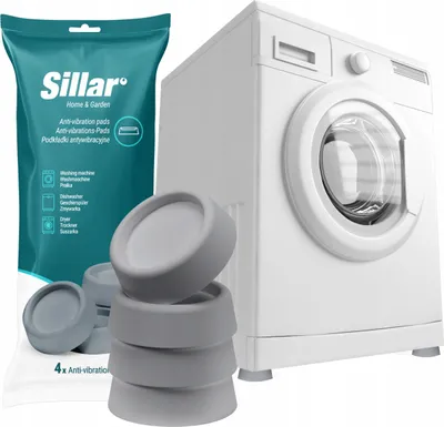 A washing machine with anti-vibration pads and packaging in front of it.