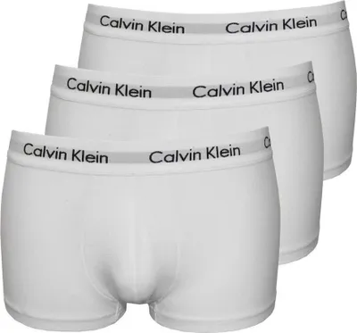 Three pairs of white Calvin Klein boxer shorts stacked on top of each other.