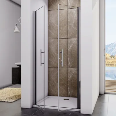 A modern bathroom with a glass shower enclosure.