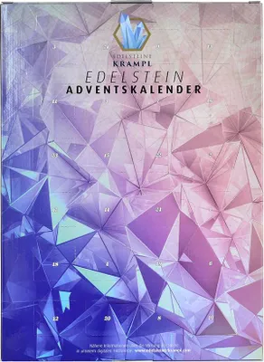 The image shows the front of an advent calendar box with a geometric crystal design.
