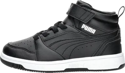 A studio shot of a single black Puma mid-top sneaker.