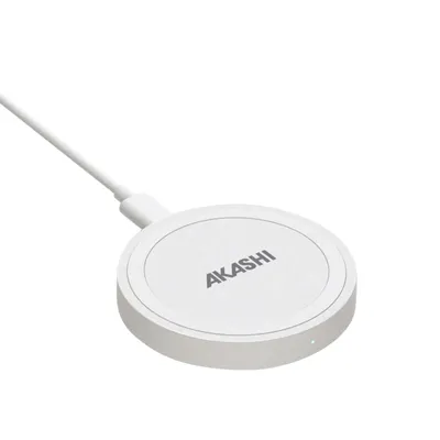 A white wireless charger with the brand name 'AKASHI' printed on it, connected to a white cable, is shown against a white background.
