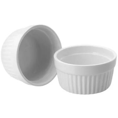 Two white ceramic ramekins are shown against a white background. One ramekin is slightly tilted and in the foreground, while the other is behind it and viewed from the inside.