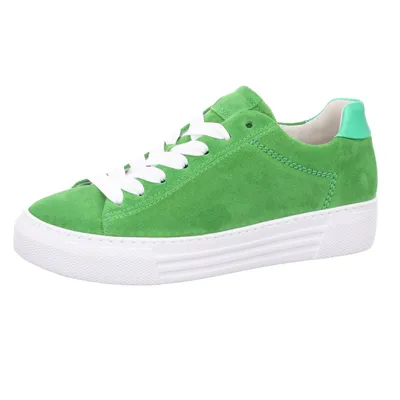 A single green sneaker with white laces and a white sole is shown against a white background.