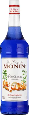 A bottle of Monin Blue Curacao syrup.