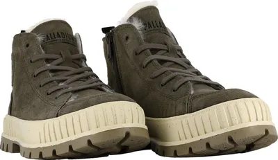 A pair of gray Palladium boots with beige soles and white fur lining, shown from a front-diagonal angle against a white background.