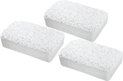Three white, porous blocks are arranged in a triangular formation on a white background.