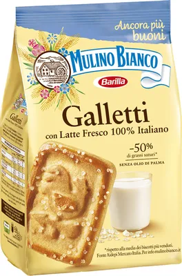 A bag of Mulino Bianco Galletti cookies with a close-up of one cookie and a glass of milk.