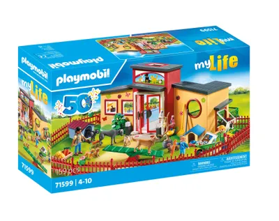 A Playmobil toy set depicting a pet hotel with various animals and figures.