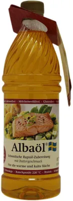 A bottle of cooking oil with a label showing a picture of salmon and vegetables.