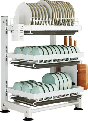 A white metal dish drying rack with plates, bowls, and cutlery on it.