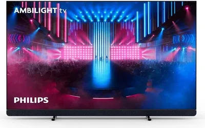 A Philips Ambilight TV displaying a concert scene with vibrant pink and blue lights.