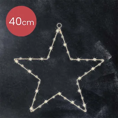 A star-shaped LED light decoration on a dark, textured background.